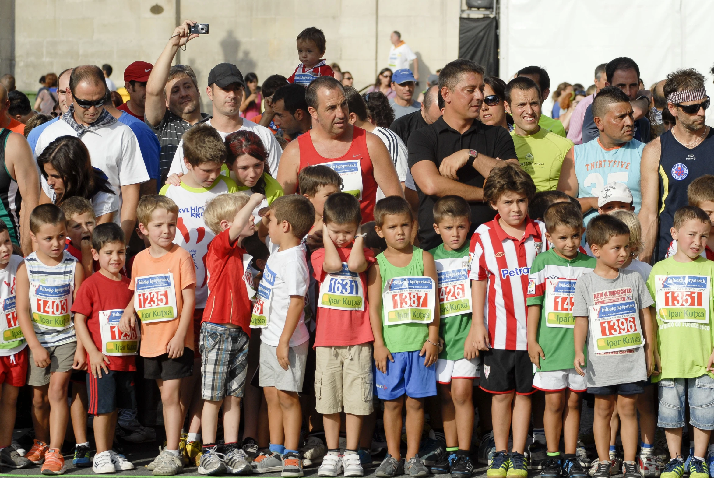 a group of young children standing next to each other