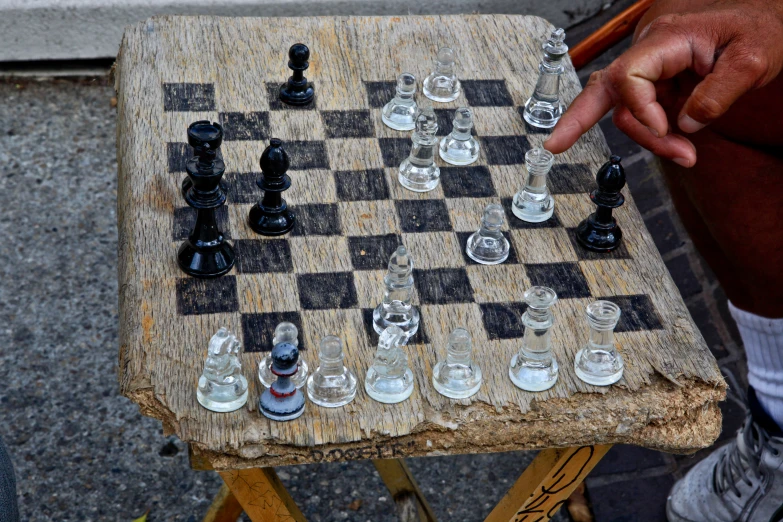 there is a man playing a game of chess