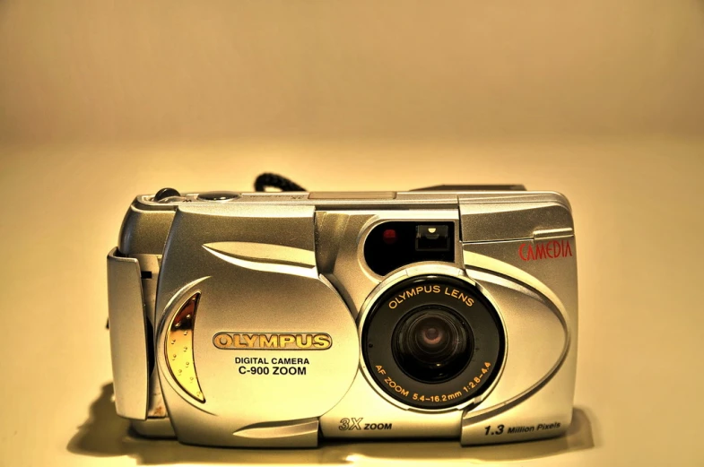 a silver digital camera sitting on a table