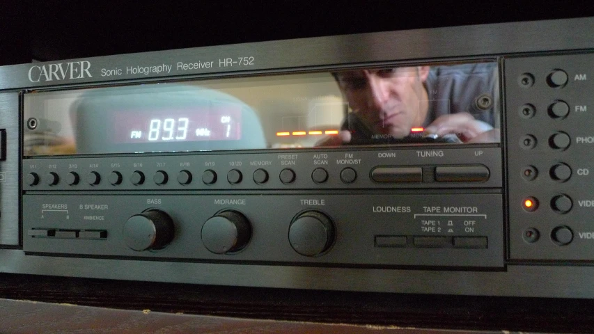 a radio that has the image of a man watching soing