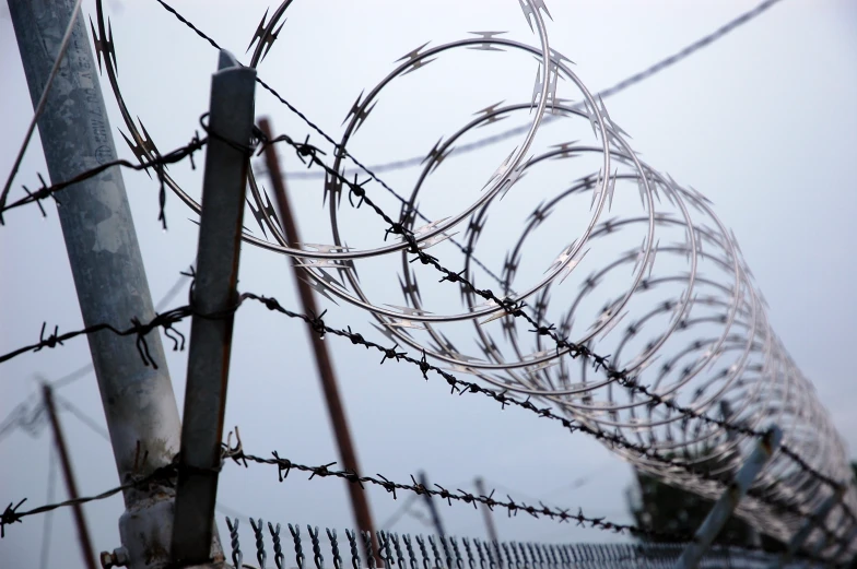 a fence with a barbed wire around it