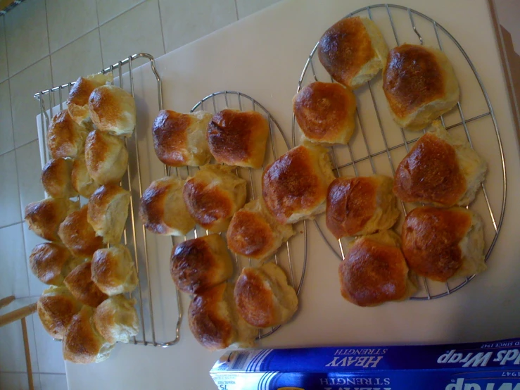 four trays of rolls and a blue book on the table