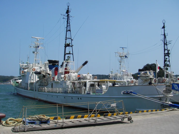 the boats are parked next to each other at the dock