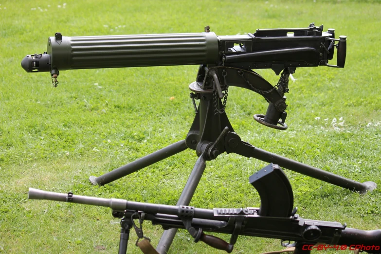 an automatic rifle with a smaller, smaller than the guns, that is on the ground
