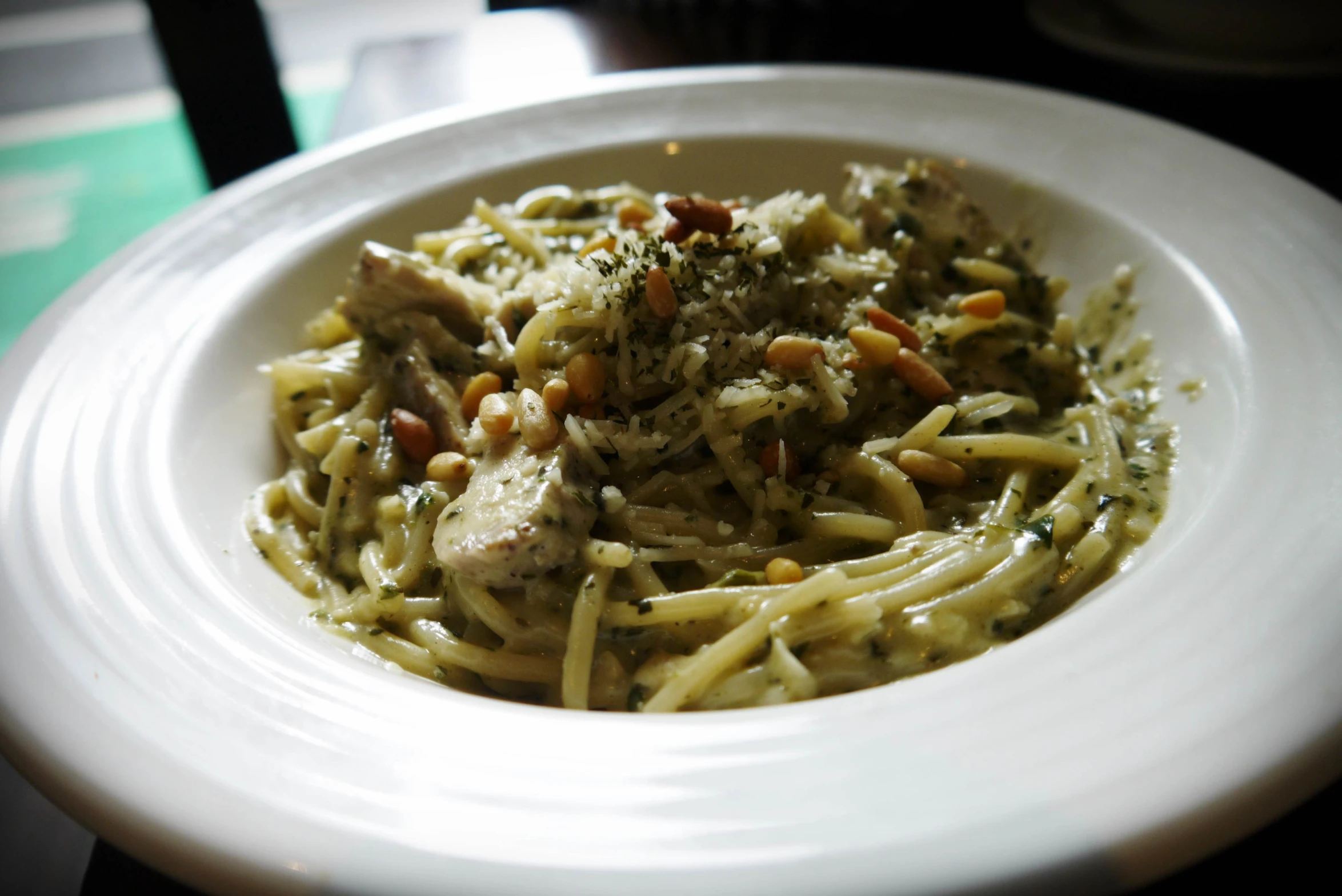 a plate of food containing pasta and sauce on a table