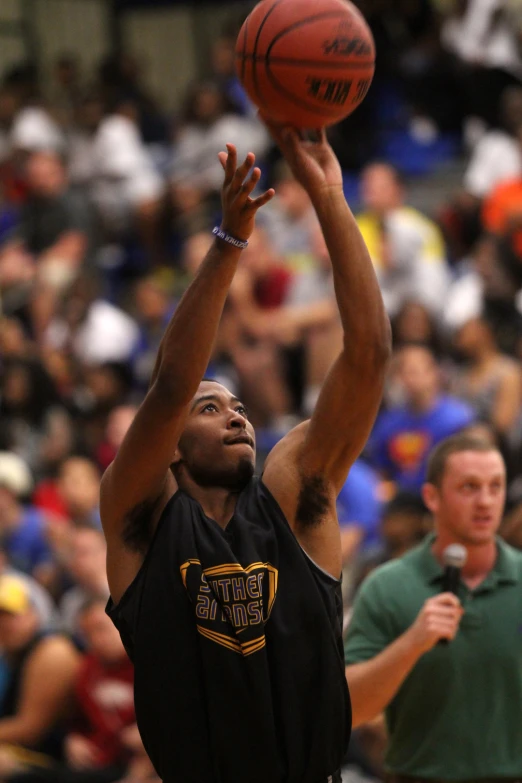 a man taking a s at a basketball