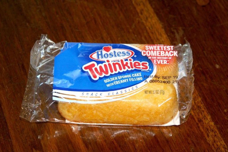 a packaged piece of food sitting on top of a wooden table