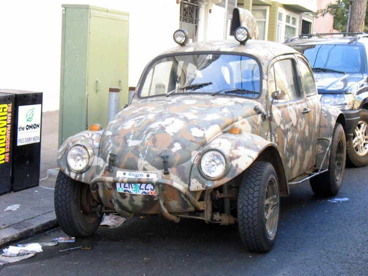 an old car sitting in the middle of the street