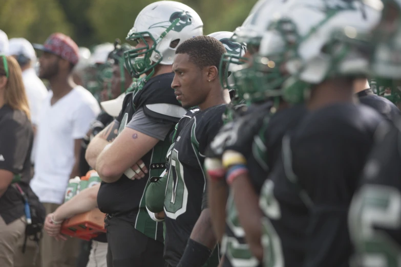 a group of football players standing next to each other