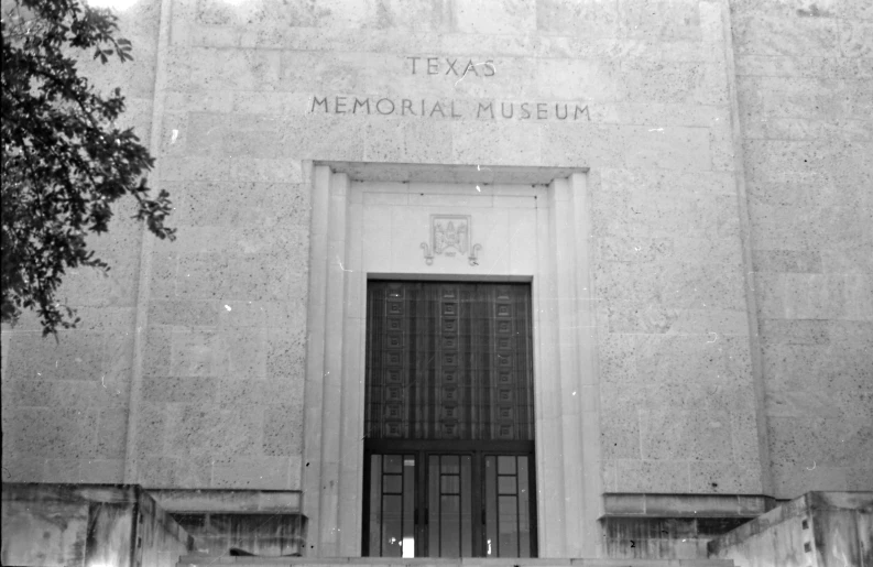 an entrance to the memorial museum on the side of a building