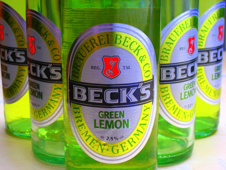 five glass bottles with the labels beck's green lemon