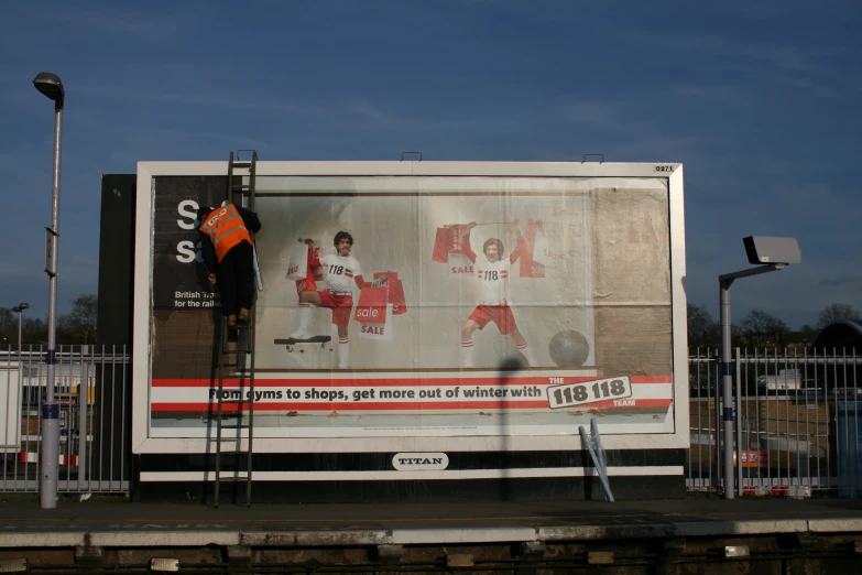 a billboard with two soccer players on it