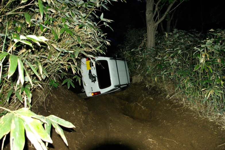 an open car door sitting on a dirt road