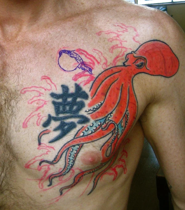 man with octo and octo in his chest tattoo