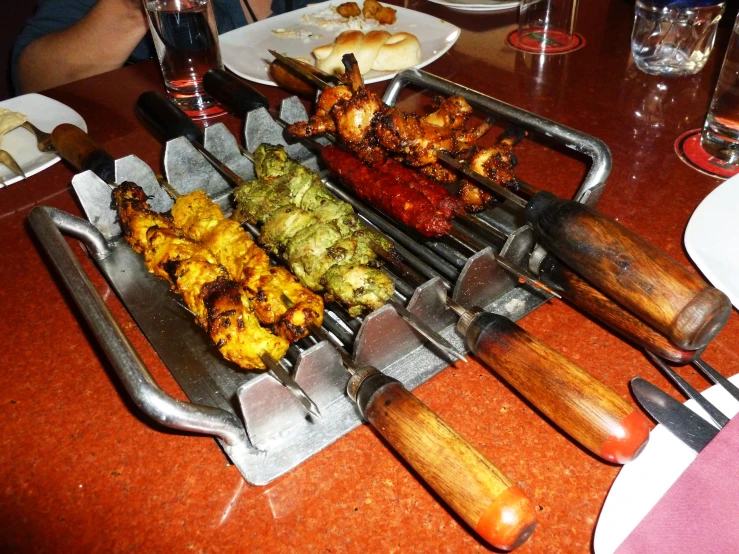 the variety of grilled food has been prepared on the table