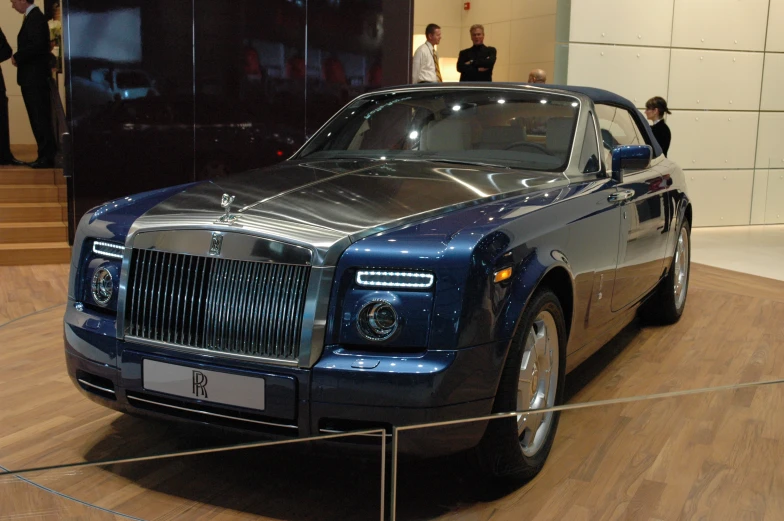 an rolls royce on display at a show
