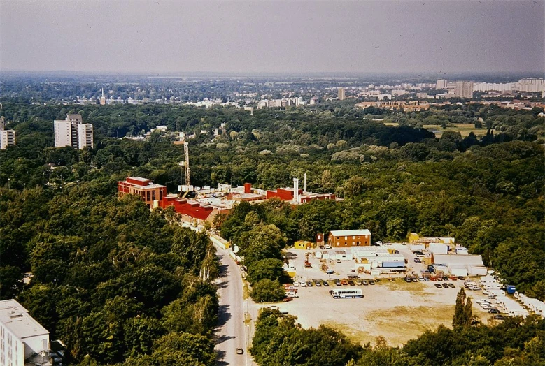 an area surrounded by tall buildings that overlook a large city