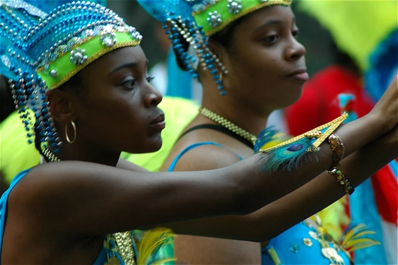 a couple of women are holding onto soing