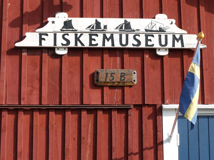 there is a red building with a sign that says fisekmuseum