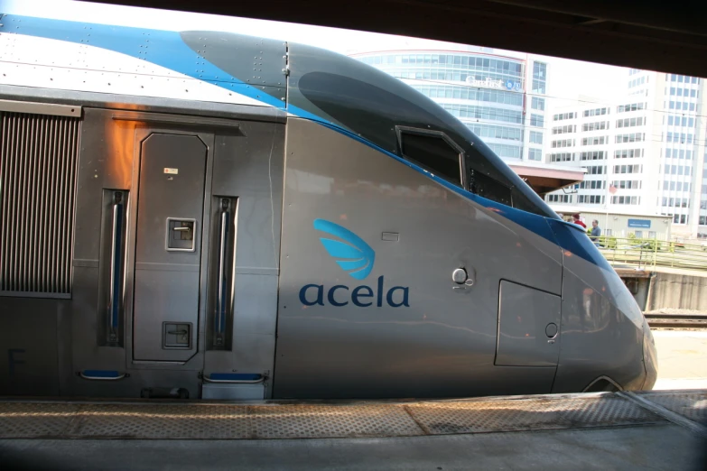 a modern looking train is parked next to the platform