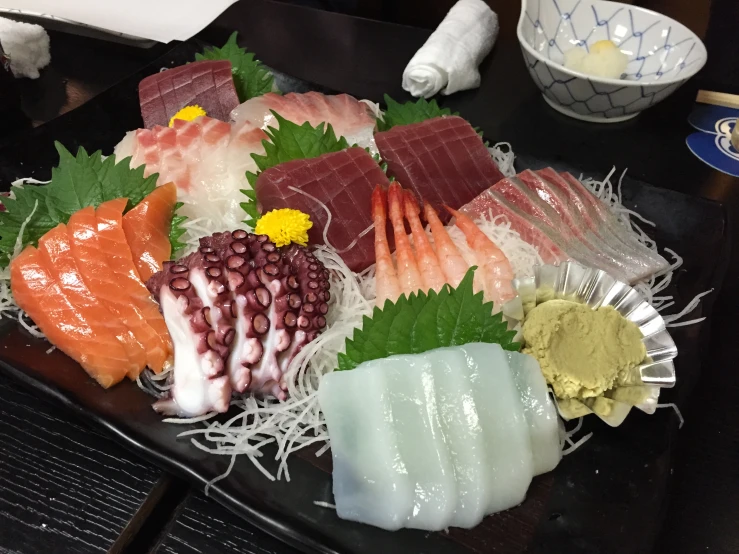 many different types of sushi on a plate