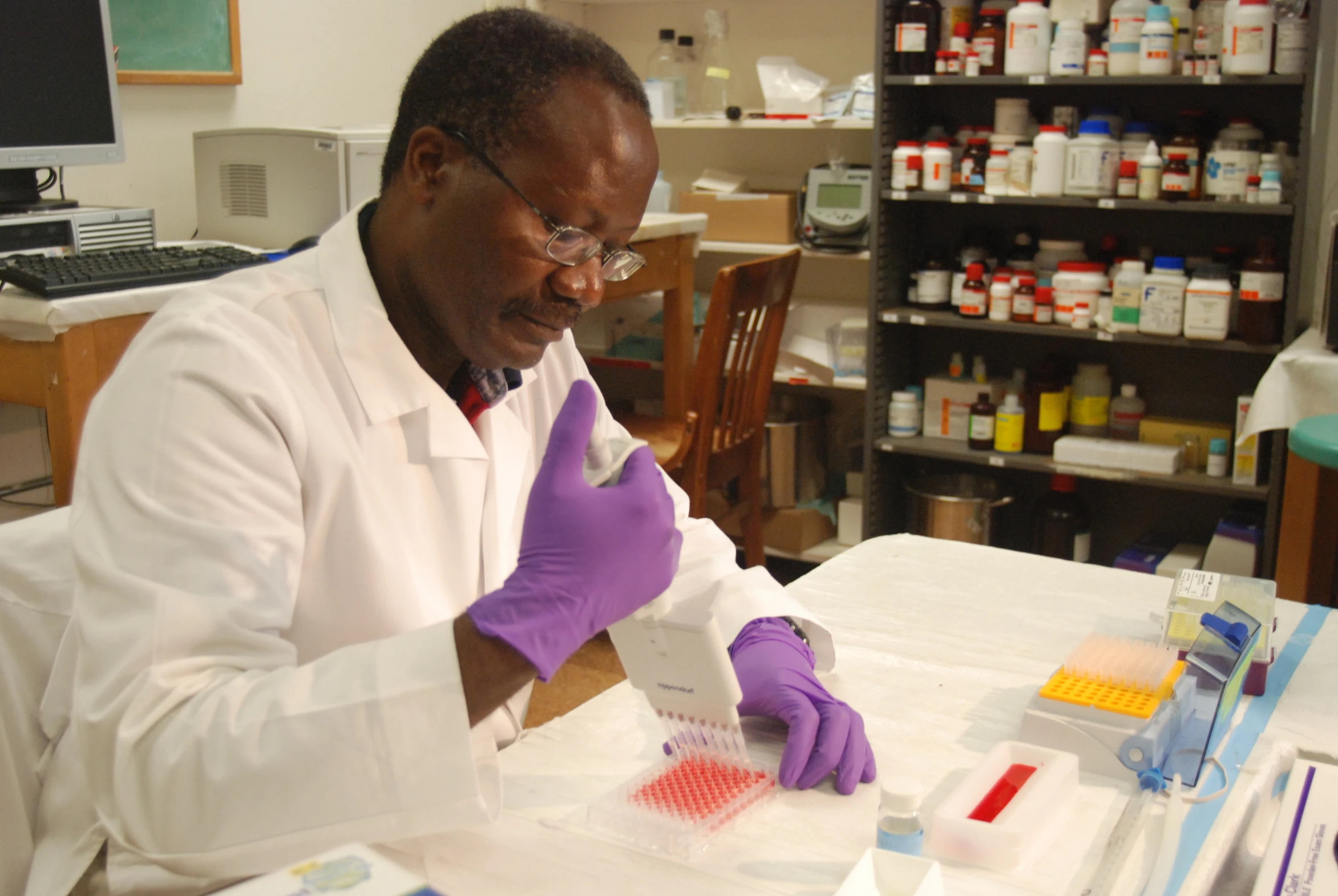 the scientist is testing sample samples in a lab