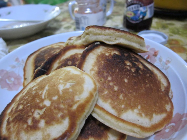 a stack of pancakes on a white plate