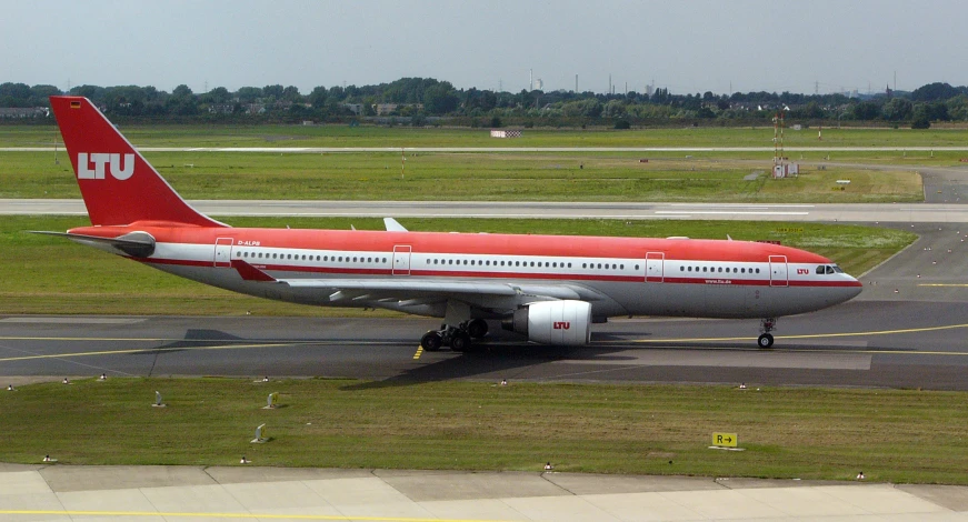 a large passenger plane is parked on the runway