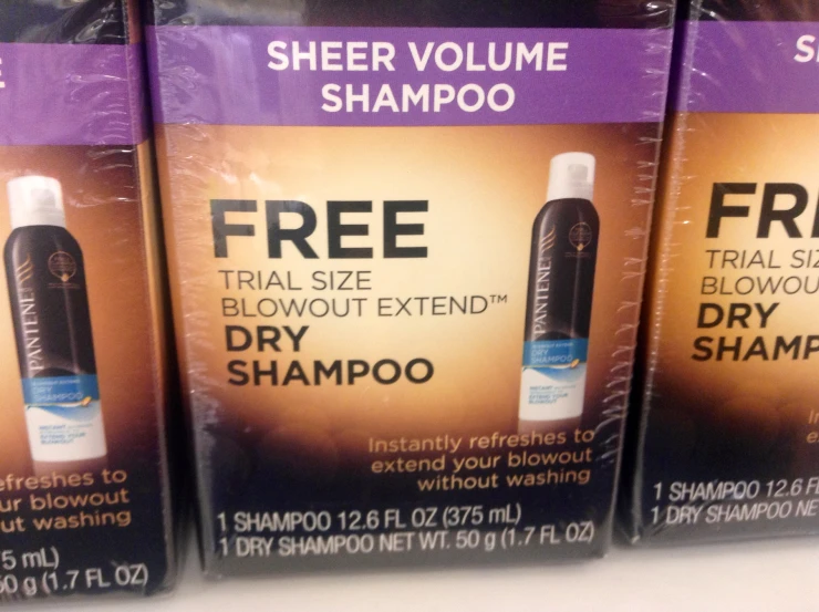 three packs of free trial size dry shampoos