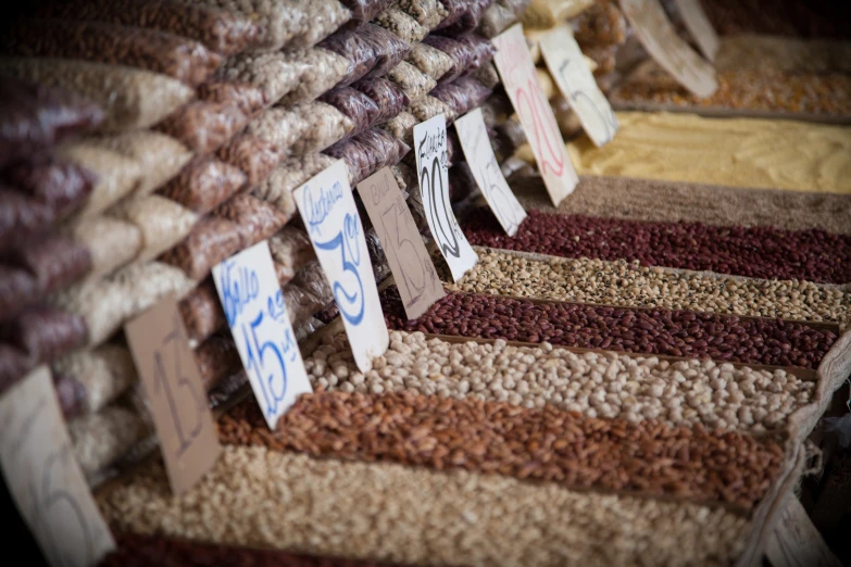 a pile of multi colored carpet next to a sale sign