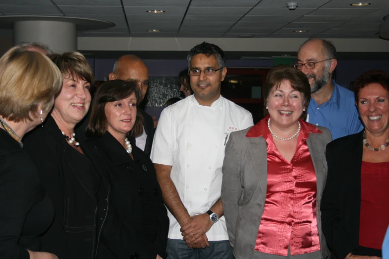 a group of women and men standing together