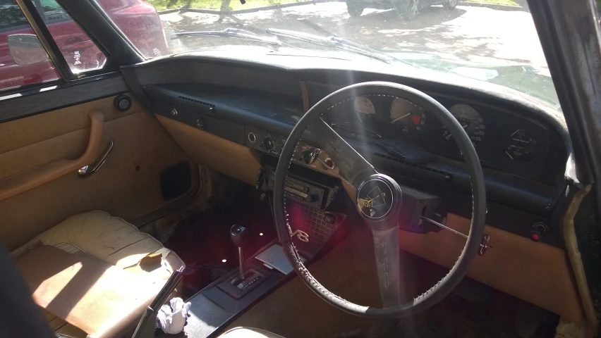 the interior of a vintage car is clean and empty