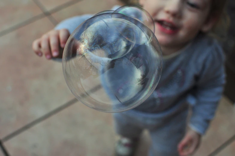 little girl showing off her new toy object