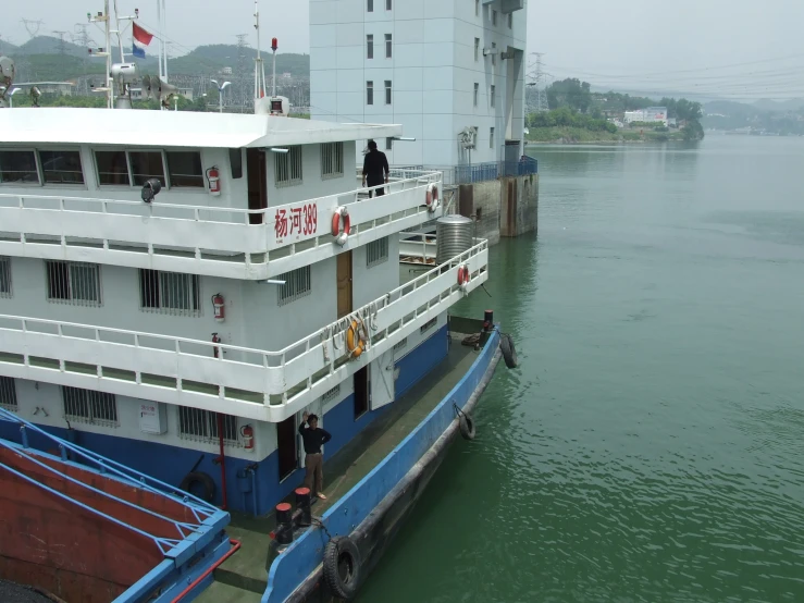 a large ship docked at a dock in a city