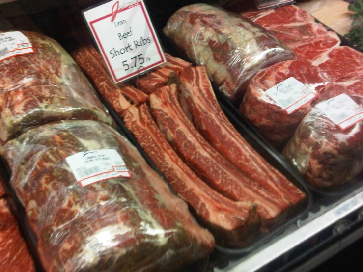 some meat in a display in a store