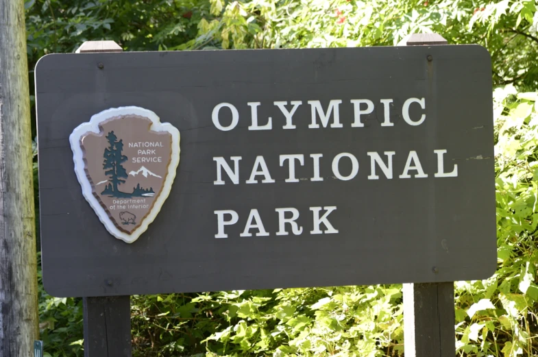 a sign saying the olympic national park has a patched out sign on it