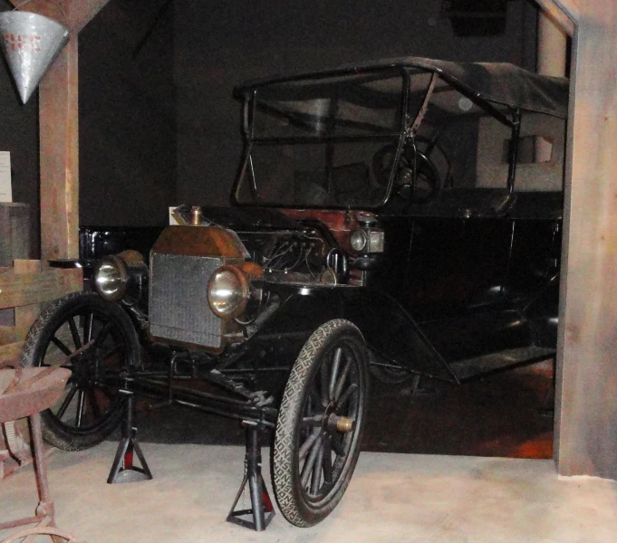 an old model t car is shown in a garage