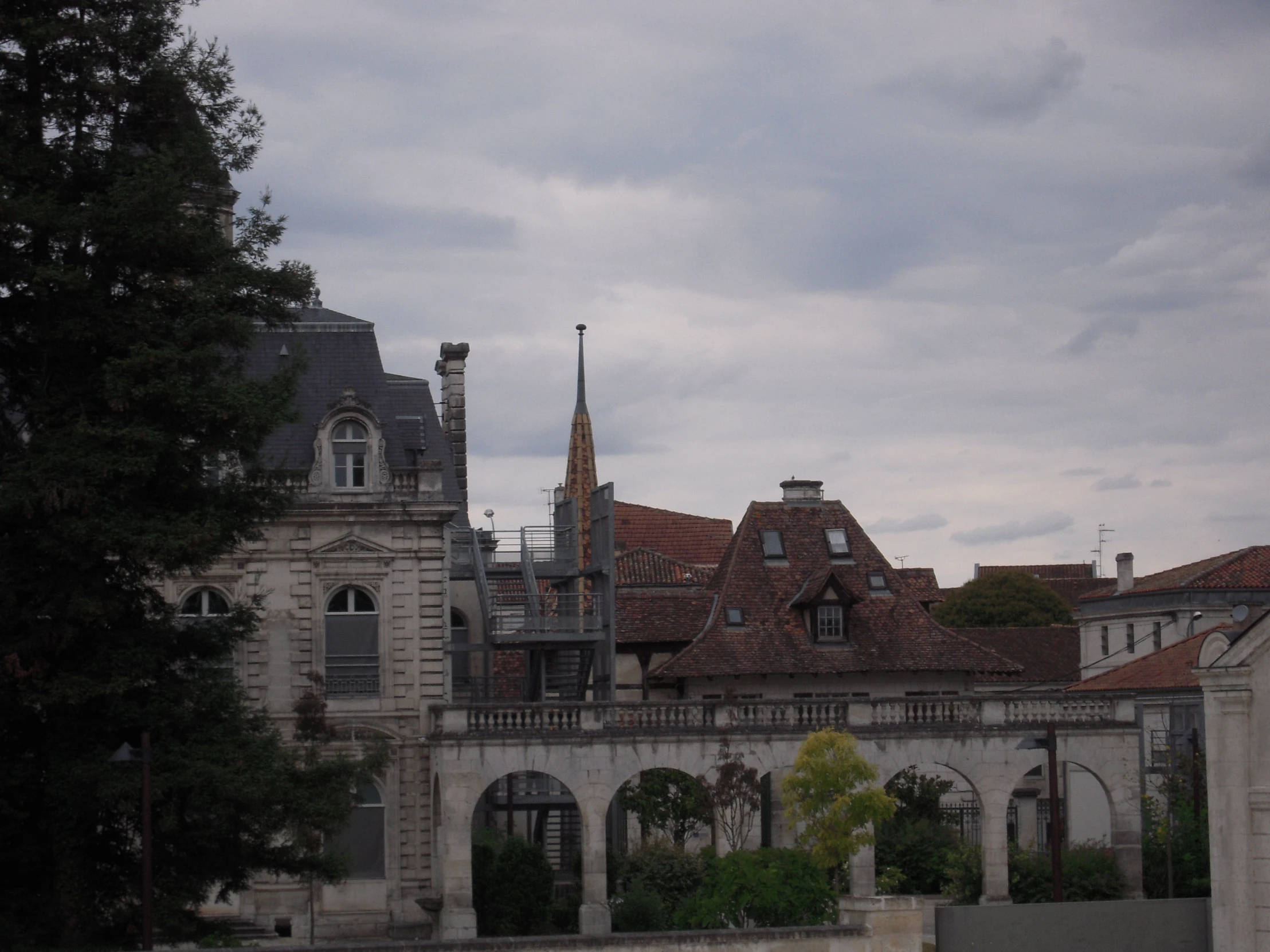 a old building with a clock and a large spire