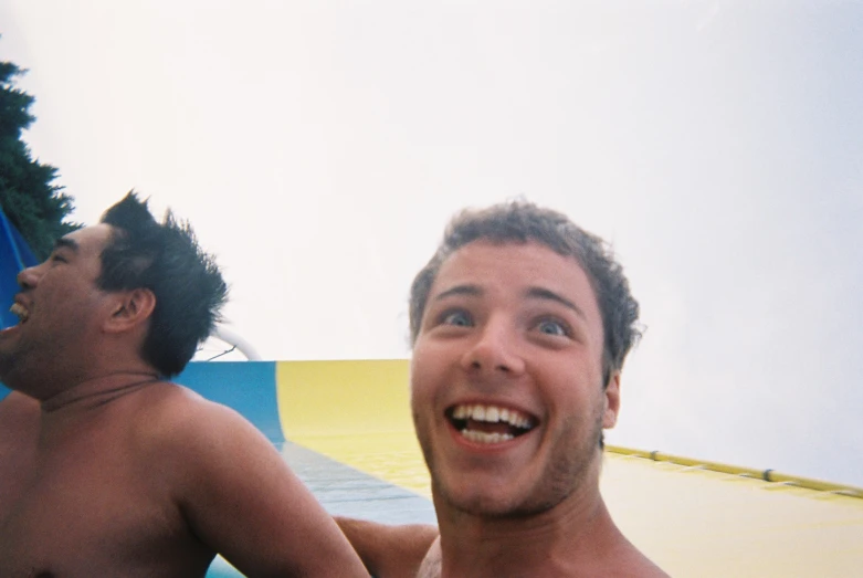 there is a man smiling in the middle of an outdoor swim