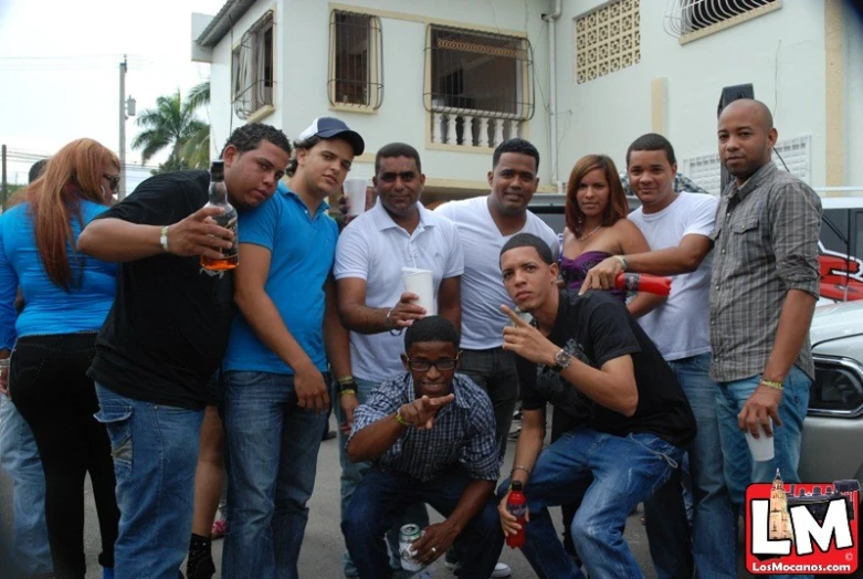 a group of young people drinking and posing for a picture