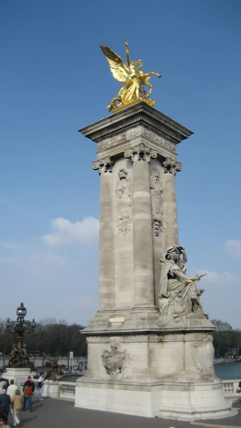 a statue that looks like a winged angel sitting on top