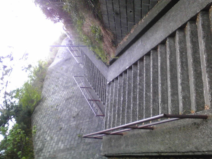 the stairs lead up to the hill above the water