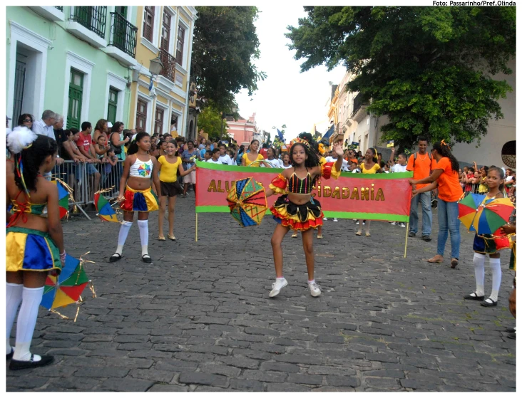 a parade with people walking in the street