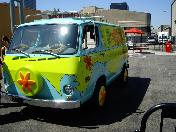 a small van with colorful design painted on it