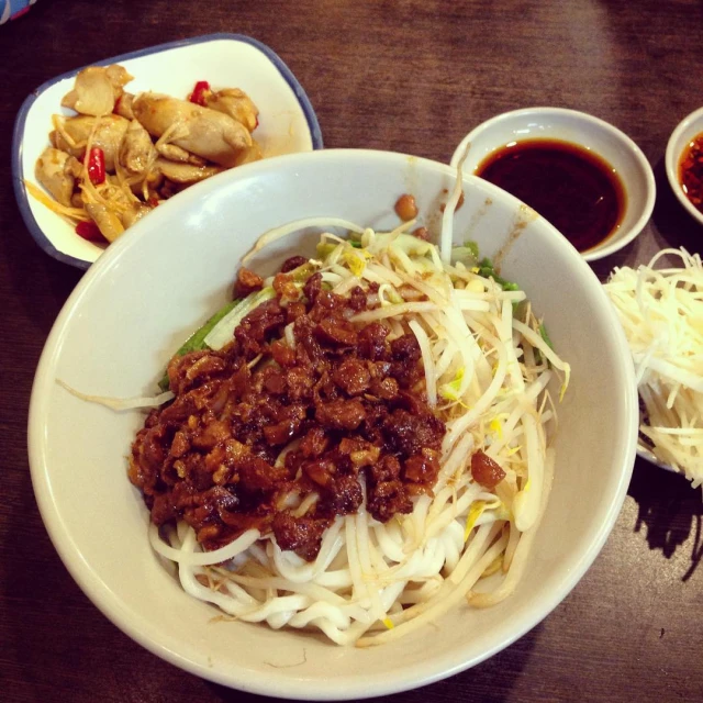 a bowl filled with a mixture of noodles and meats