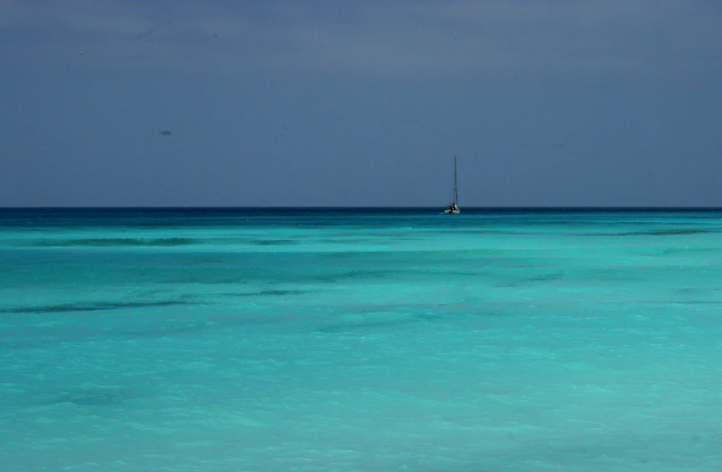 an image of a sailboat out in the ocean