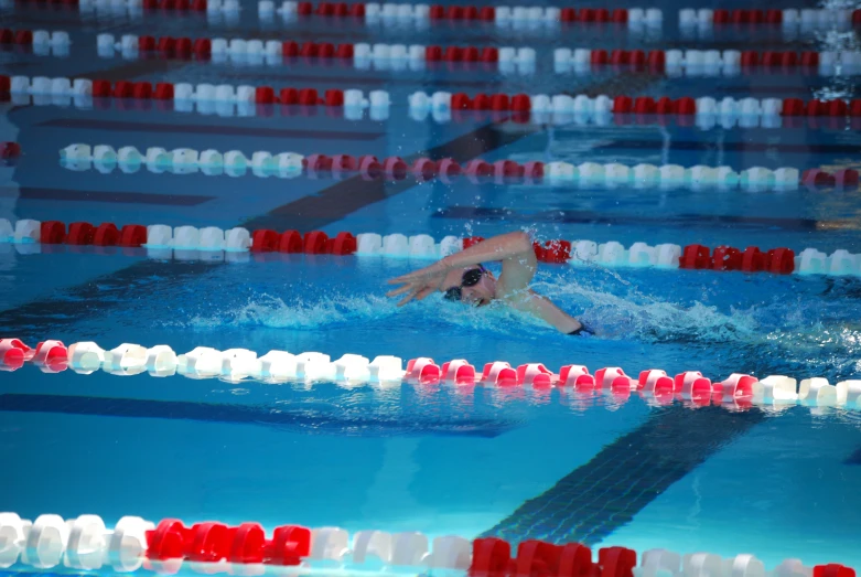 the swimmer is racing a pool in clear water