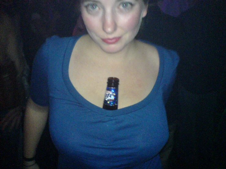 a women with a beer in her neck