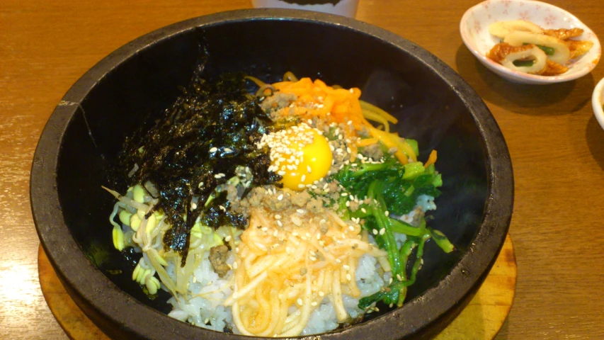 a plate full of different vegetables and rice