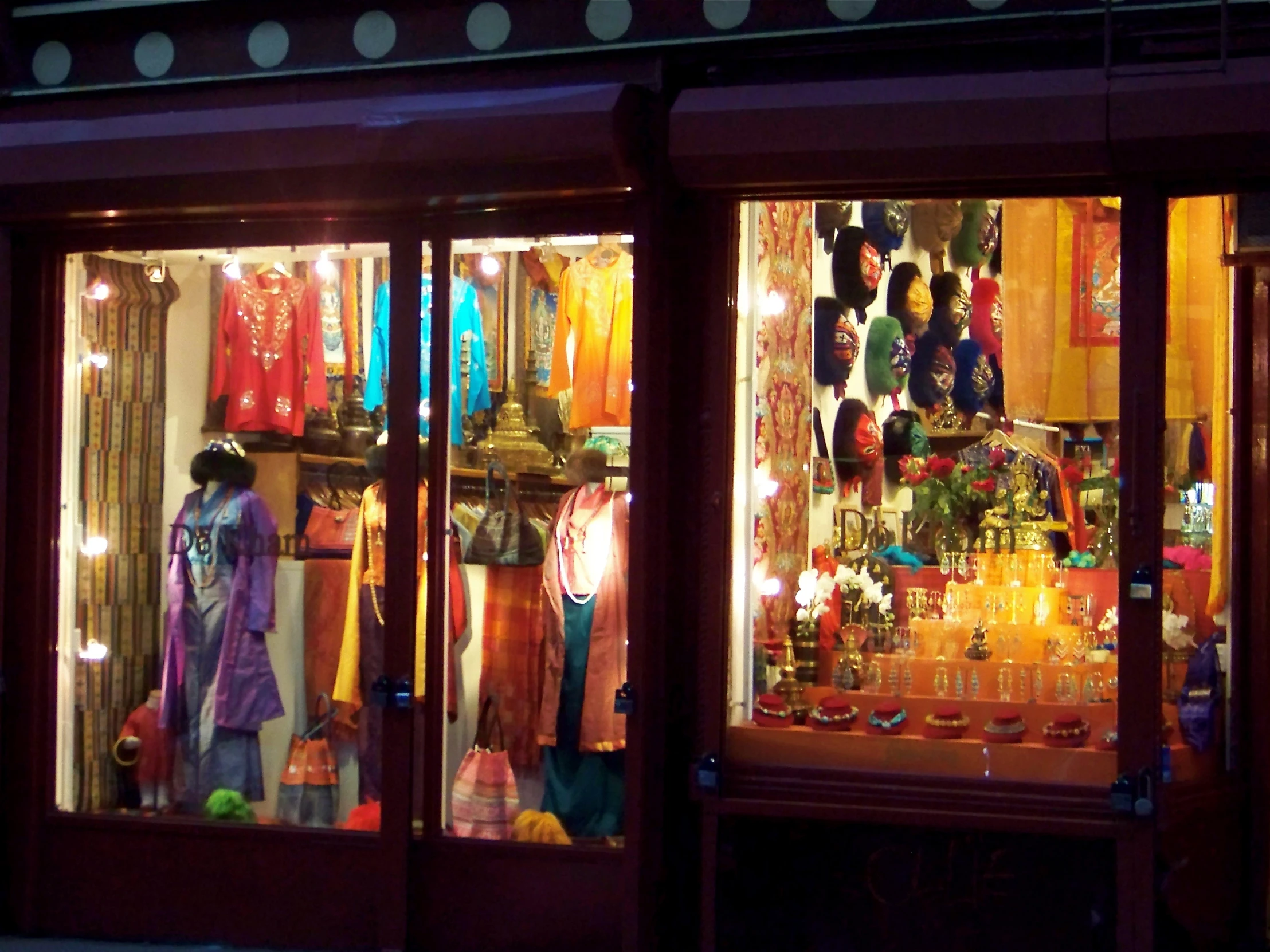 the shop front is brightly lit up at night